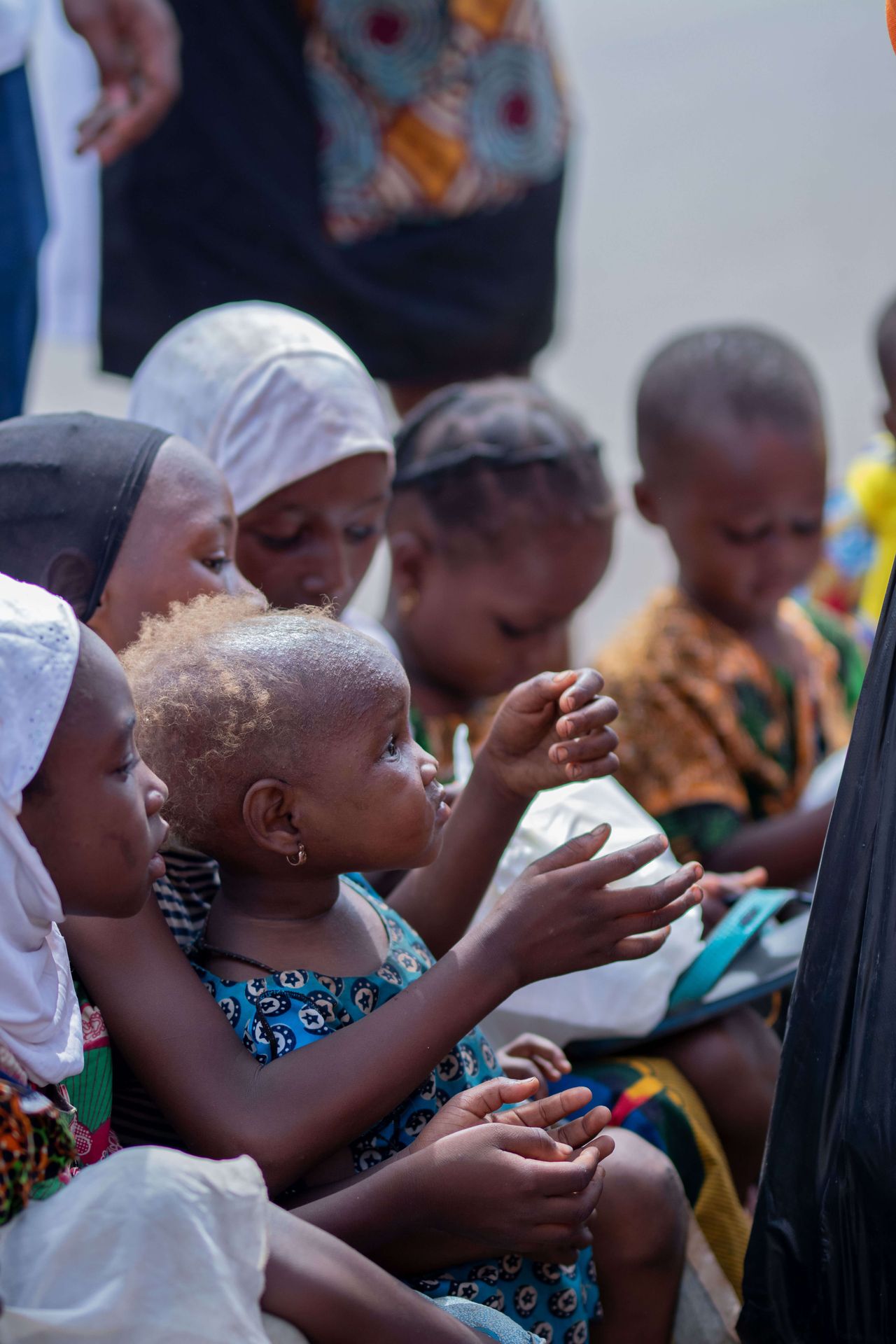 Children receiving food packs from AdvoCare volunteers